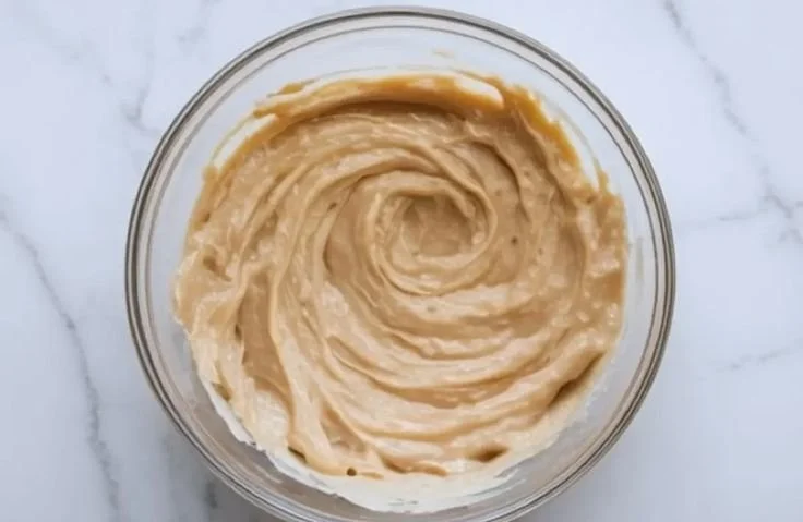 Decadent almond croissant filled with sweet almond paste and topped with sliced almonds.