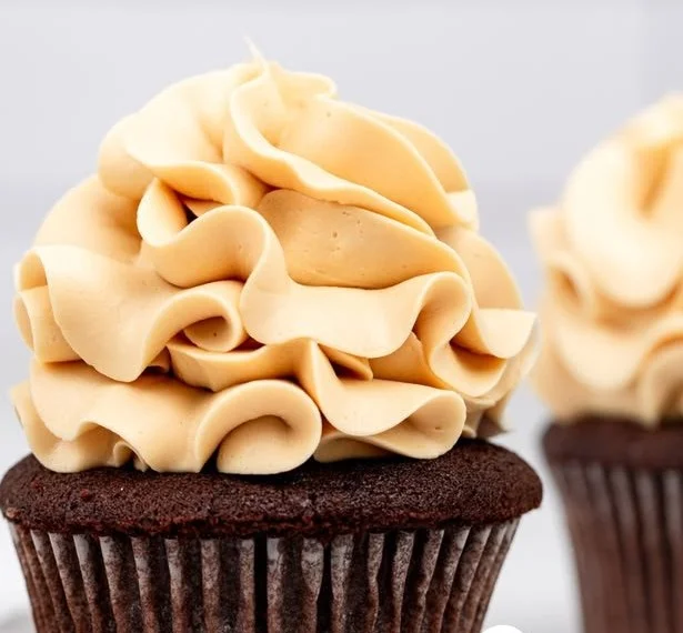 Delicious caramel buttercream frosting spread on a cake