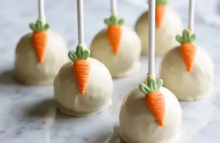 Delicious carrot cake pops decorated with cream cheese frosting