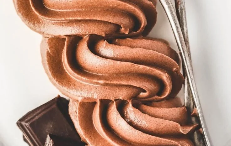 Delicious Chocolate Buttercream Frosting on a chocolate cake