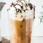Refreshing chocolate iced coffee topped with whipped cream and chocolate shavings