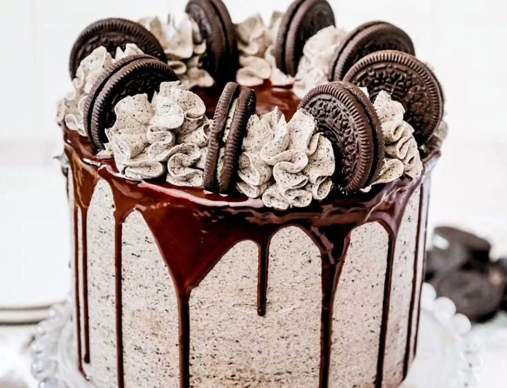 Decadent Chocolate Oreo Cake topped with creamy frosting and Oreo crumbs
