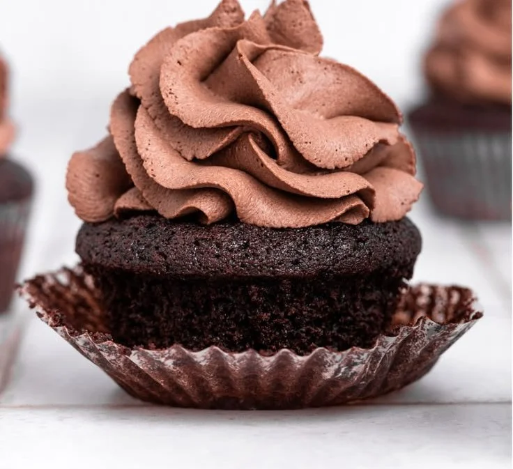 Delicious chocolate whipped cream frosting topping a cake