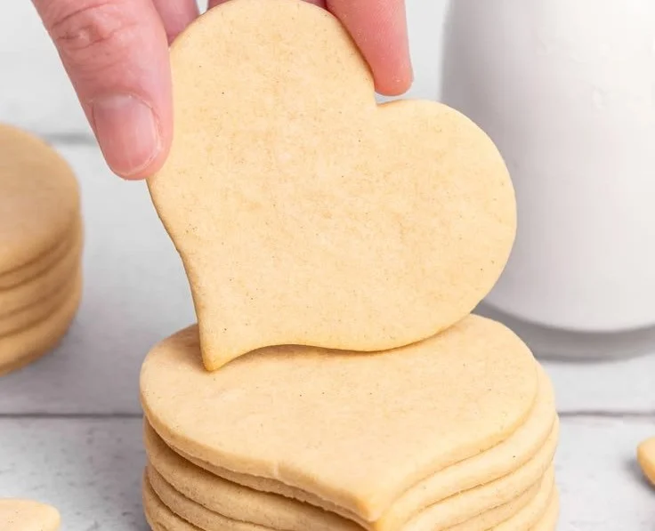 Delicious classic sugar cookies decorated with colorful icing and sprinkles