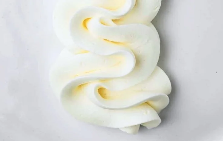 Delicious condensed milk buttercream frosting on a cake