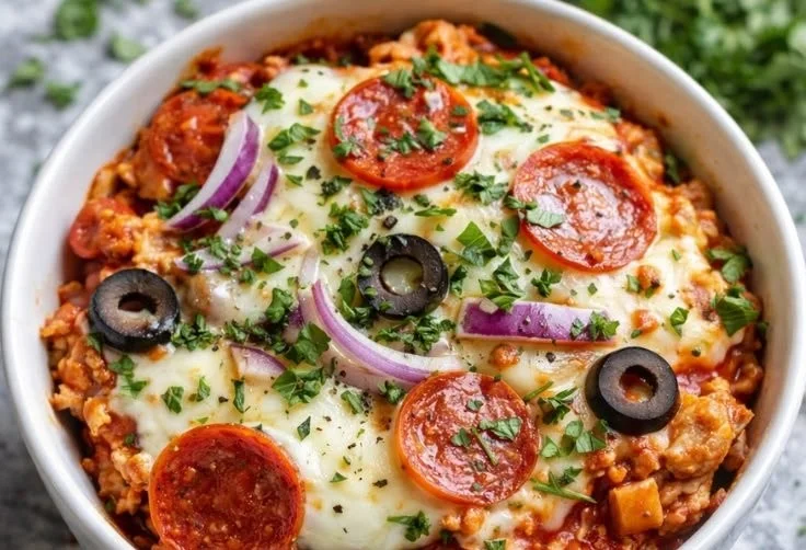 Healthy cottage cheese pizza bowl topped with fresh ingredients and herbs.