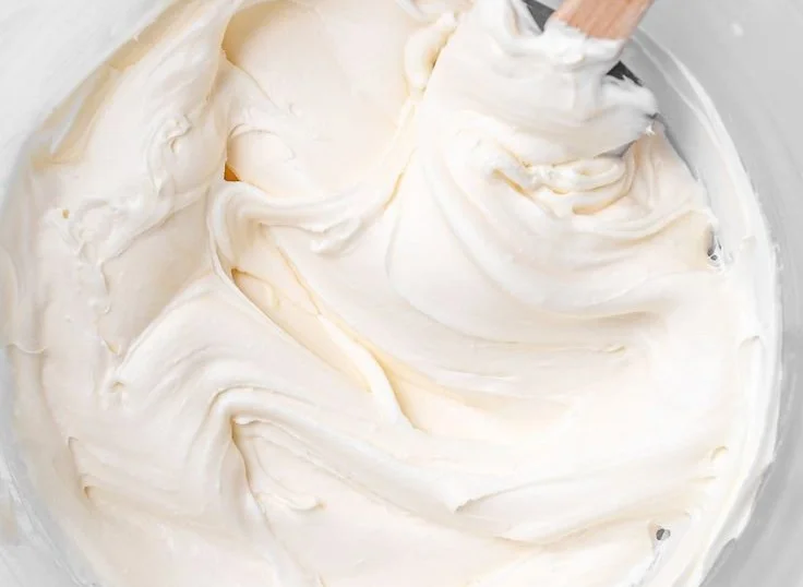 Delicious cream cheese frosting topping on a chocolate cake