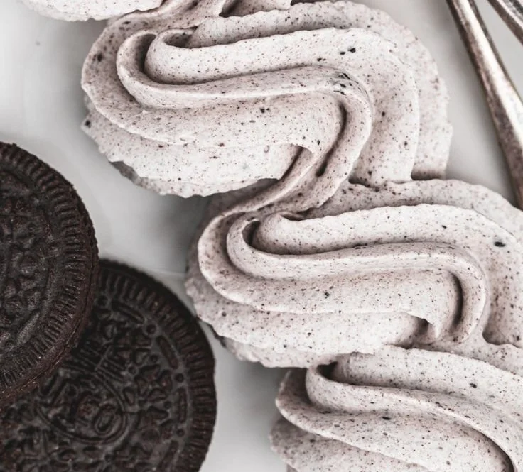 Delicious cookies and cream frosting on a chocolate cupcake.