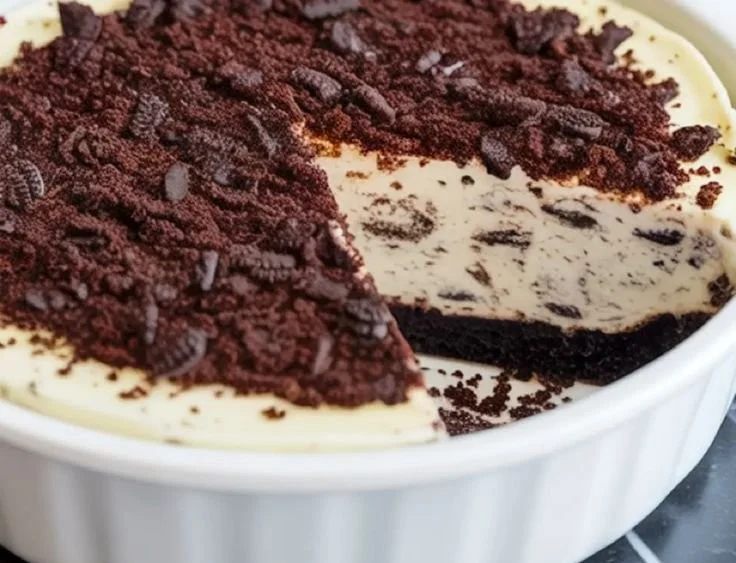 Delicious slice of Oreo cheesecake topped with crushed Oreo cookies