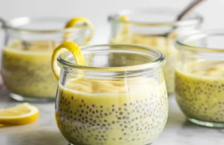 Delicious bowl of lemon chia pudding topped with fresh lemon slices and mint