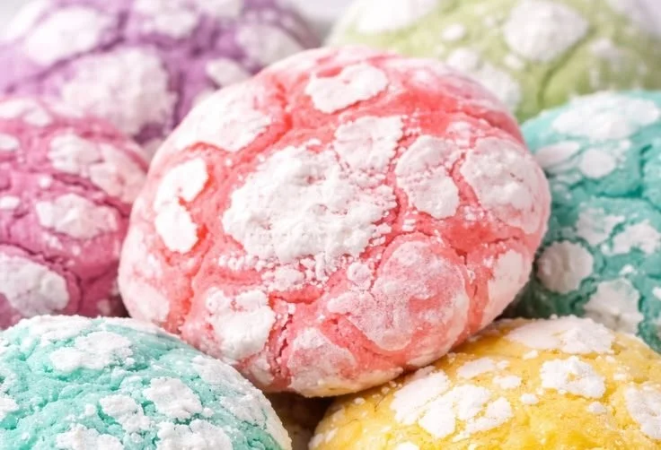 Freshly baked Lemon Crinkle Cookies with powdered sugar coating