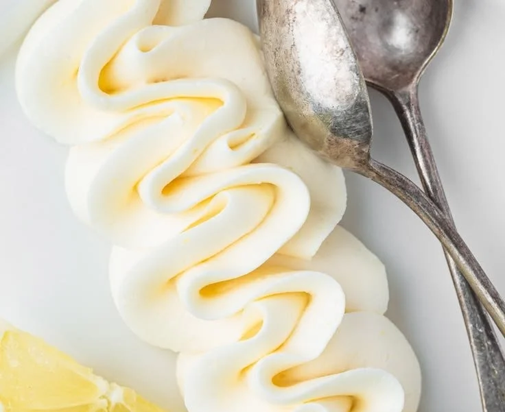 Delicious lemon curd buttercream frosting on a cake