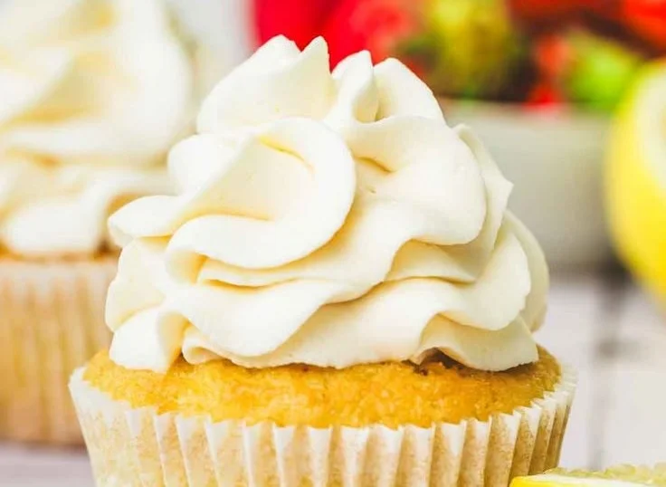 Delicious lemon curd cream cheese frosting swirled on a cake