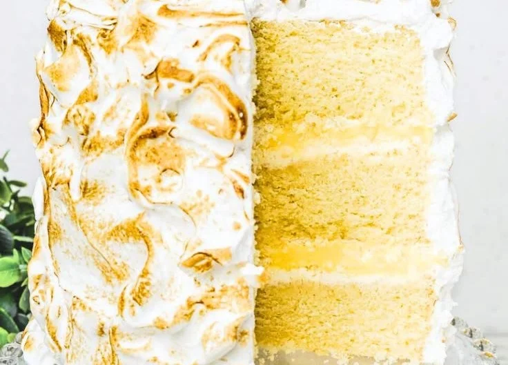 Lemon layer cake with lemon curd filling, beautifully layered and garnished.
