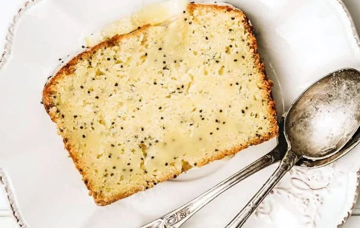 Moist lemon poppy seed pound cake topped with a light glaze