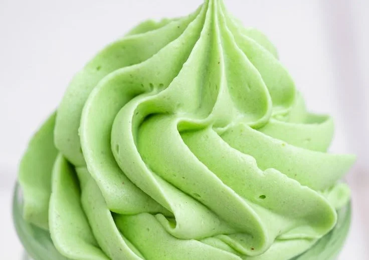 Delicious pistachio buttercream frosting on a cupcake