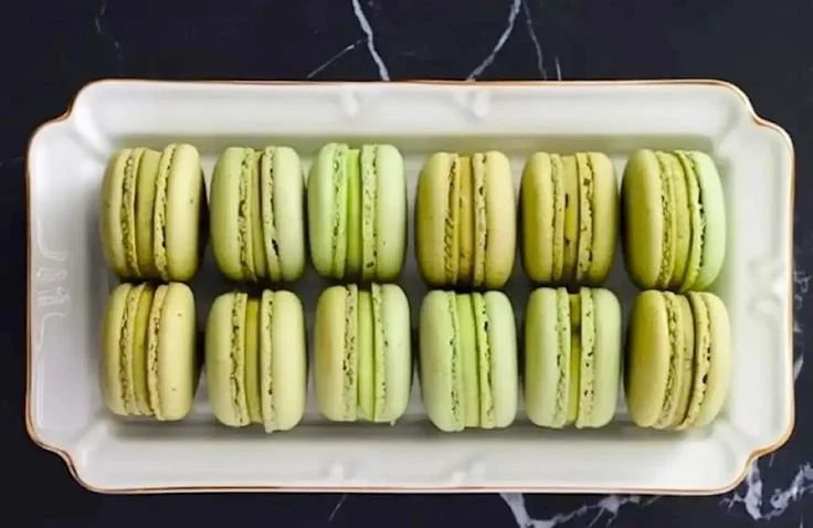Pistachio Coconut Macarons on a decorative plate