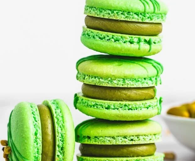 Delicious homemade pistachio macarons on a decorative plate