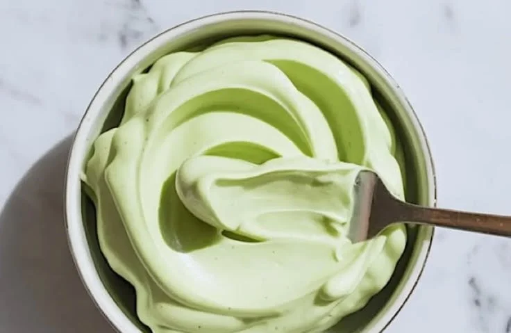 Pistachio Mascarpone Cake with creamy filling and topped with nuts