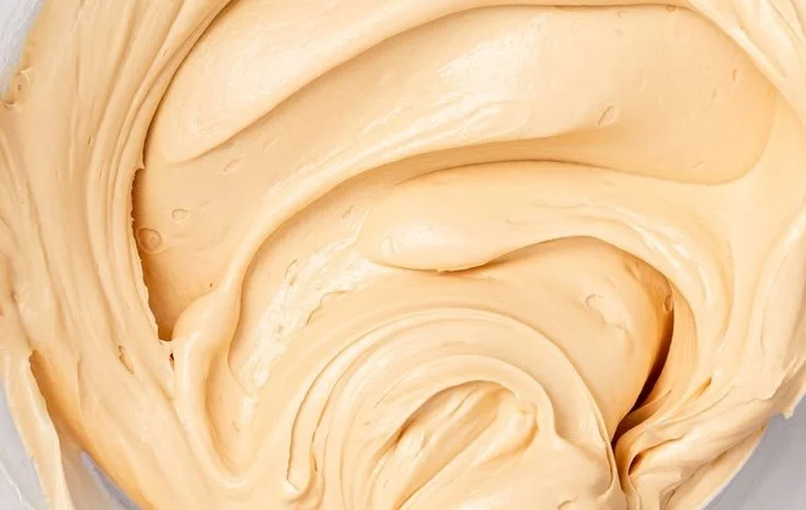 Delicious salted caramel buttercream spread on a cake