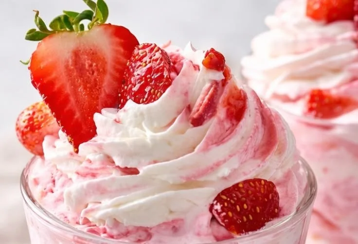 A delicious Strawberry Dole Whip served in a colorful cup, a refreshing dessert option.