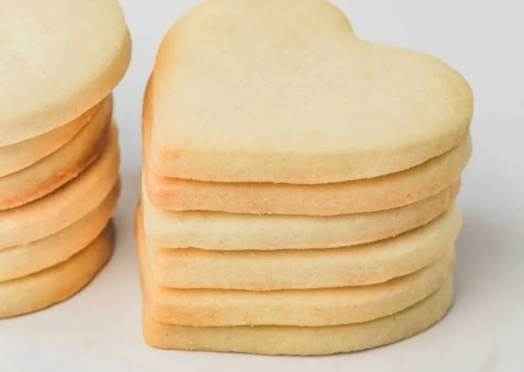 Delicious homemade sugar cookies on a plate, perfect for any celebration.