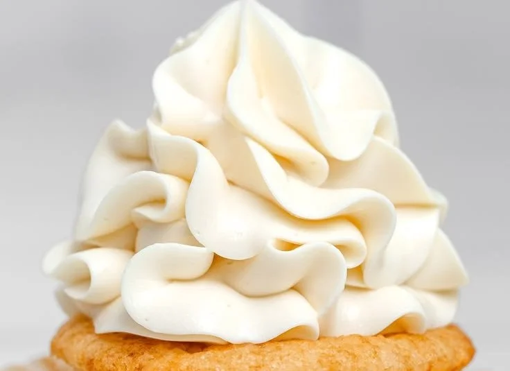 Delicious Vanilla Swiss Meringue Buttercream spread on a cake