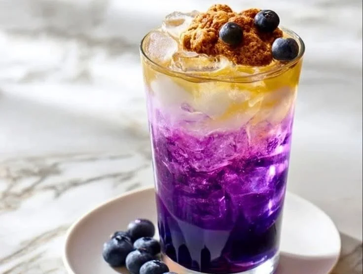 Blueberry muffin dirty soda recipe with fresh blueberries and fizzy soda