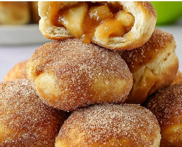 Deliciously baked caramel apple pie bombs with a golden crust and caramel drizzle.