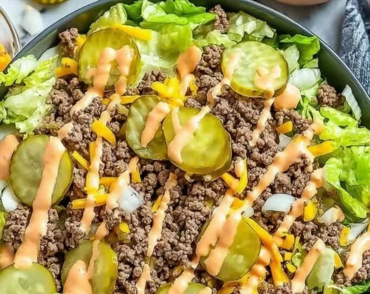 Cheeseburger-inspired bowl with beef, lettuce, tomato, and cheese.