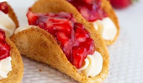 Delicious cheesecake tacos served on a plate with toppings