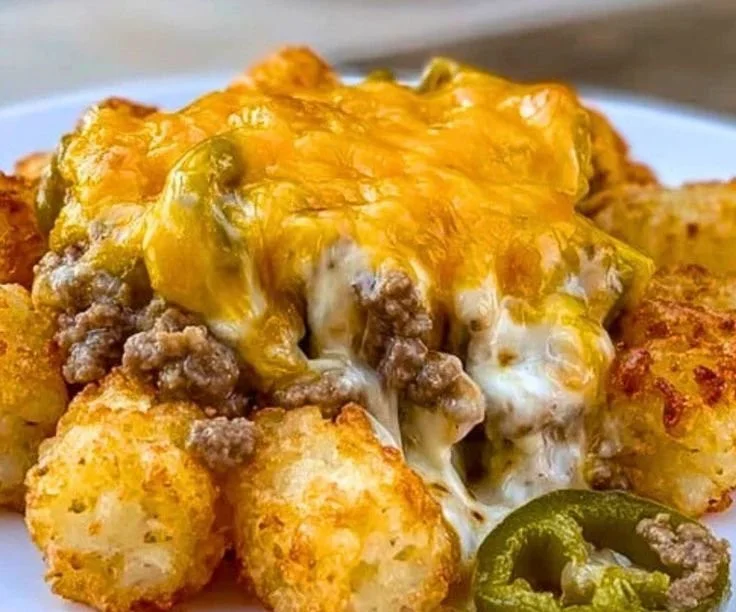 Cheesy ground beef tater tot casserole dish with crispy topping and melted cheese