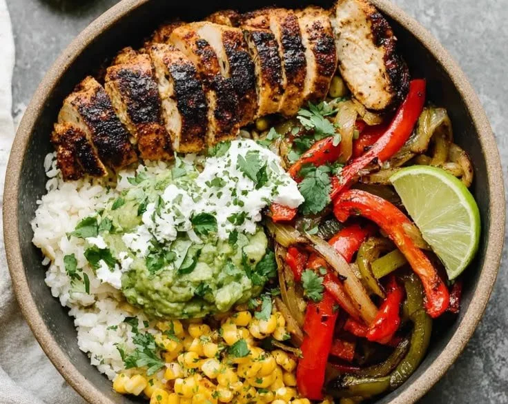Delicious chicken fajita bowl with colorful vegetables and spices
