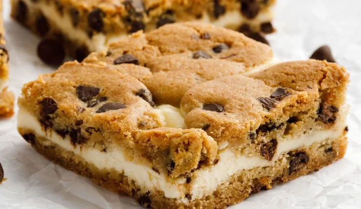 Delicious chocolate chip cheesecake bars served on a plate