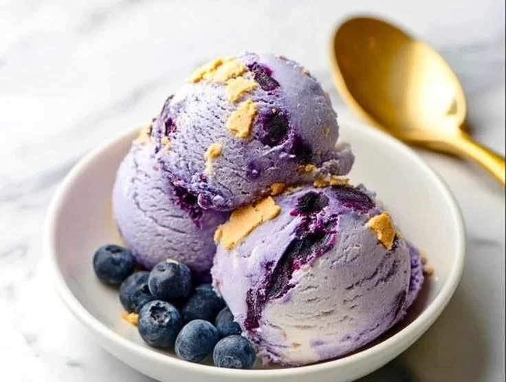 Creamy Ninja Creami blueberry cheesecake protein ice cream in a bowl