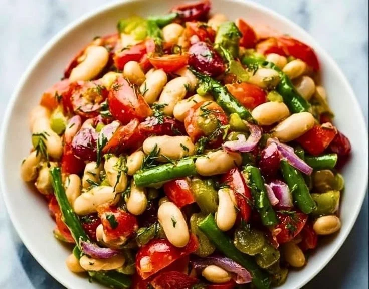 Delicious dense bean salad with various legumes in a colorful bowl