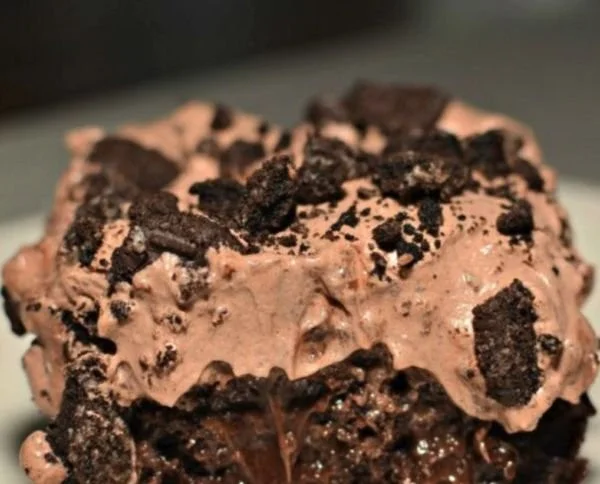 Delicious homemade Dirt Cake topped with Oreo crumbs and gummy worms
