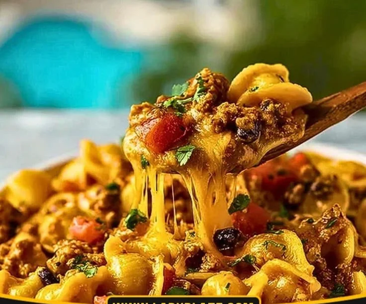 Delicious chicken taco pasta in a bowl with toppings