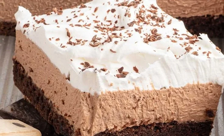Deliciously rich French Silk Brownies on a white plate