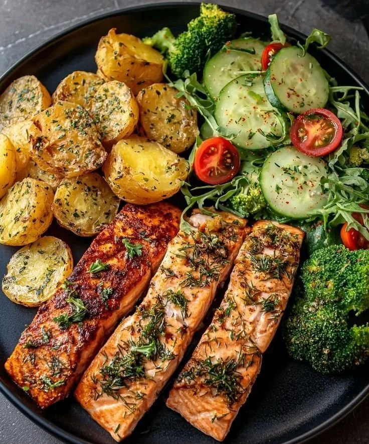 Herb-Crusted Salmon fillet with roasted baby potatoes on a plate