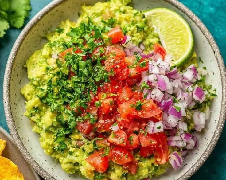 Bowl of authentic guacamole made with fresh ingredients.