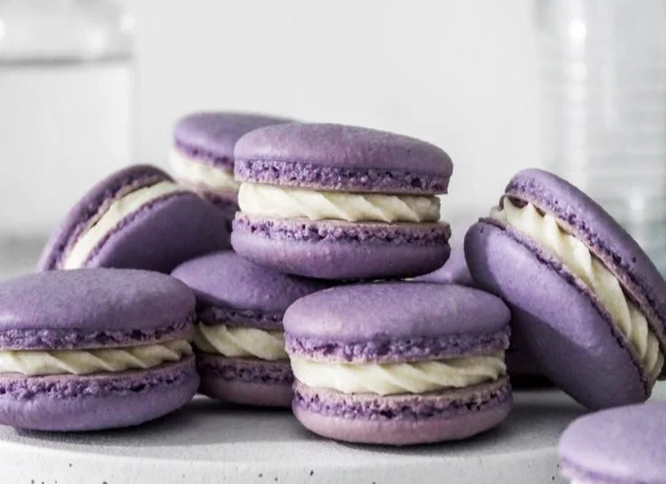Assorted colorful macarons arranged on a tray