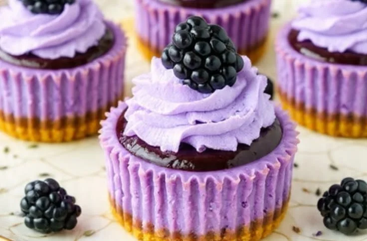 Mini blackberry lavender cheesecake bites on a white plate