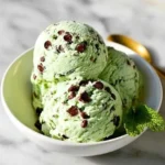 Mint Chocolate Chip Protein Ice Cream in a bowl with chocolate chips