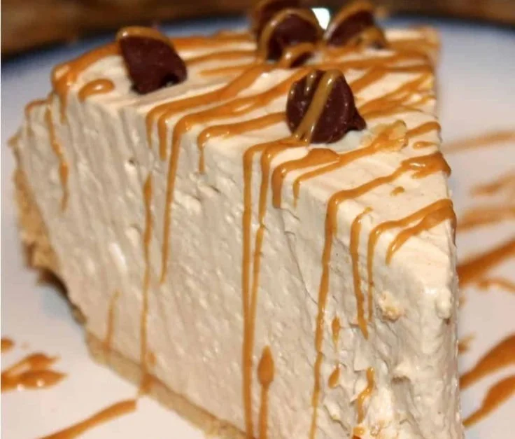 No-bake peanut butter pie topped with chocolate and whipped cream