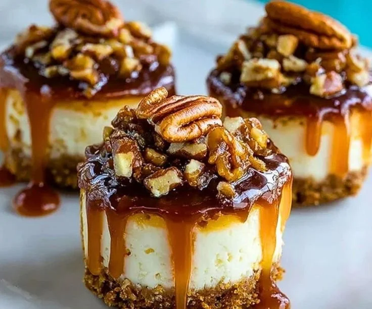 No-Bake Turtle Cheesecake Minis topped with chocolate and caramel sauce