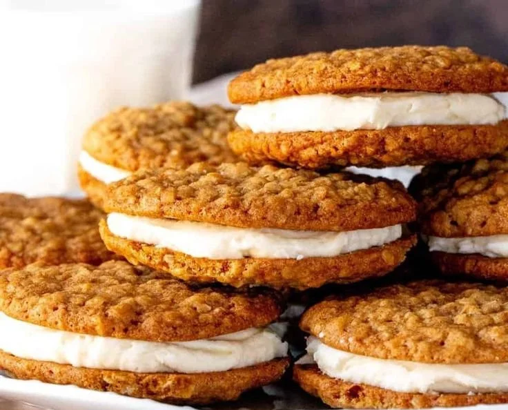 Homemade Oatmeal Cream Pies on a wooden plate