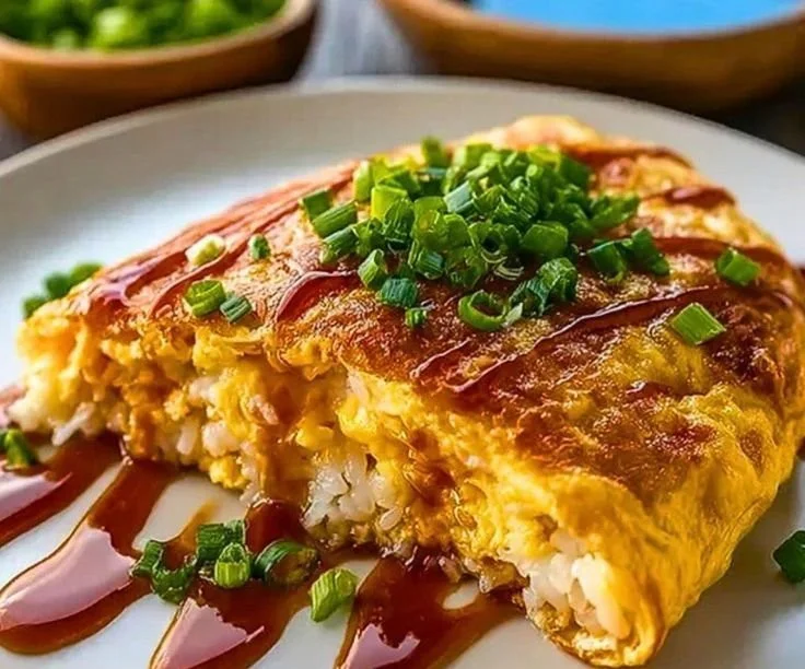 Delicious omurice dish with fluffy omelette and fried rice served on a plate