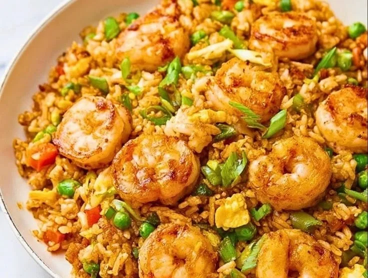 One-skillet shrimp fried rice dish prepared at home, resembling takeout style.