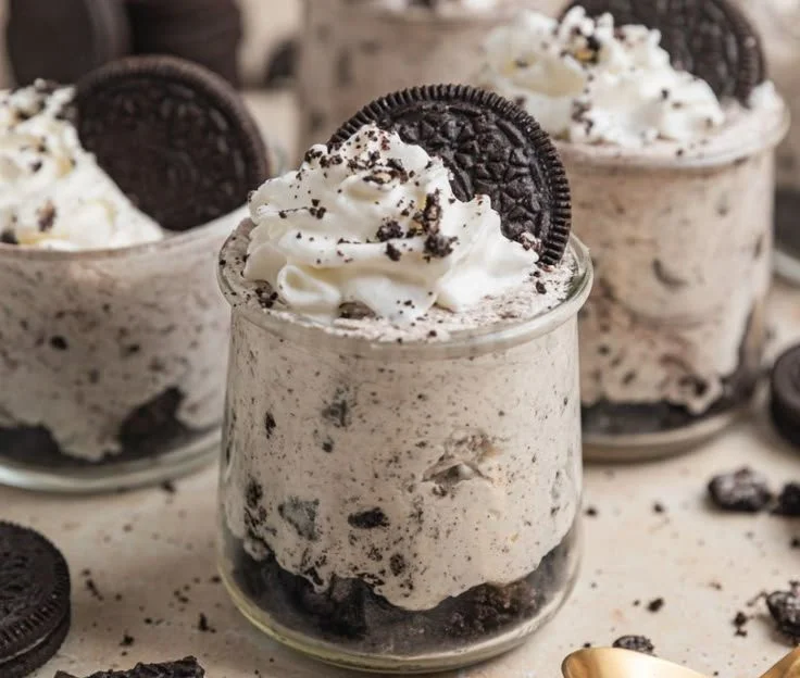 Delicious Oreo no-bake cheesecake cups topped with crushed Oreos